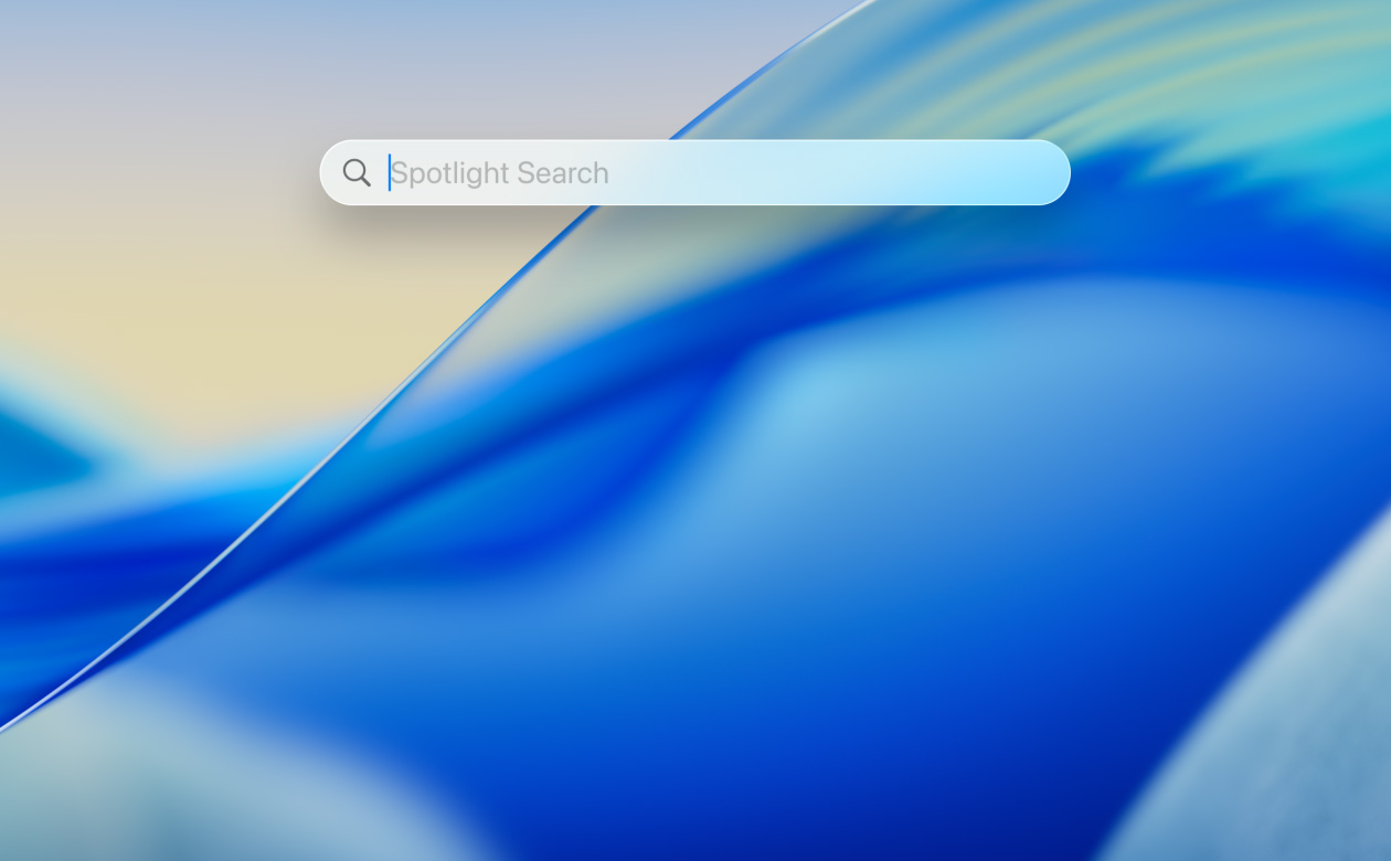 A MacBook Pro showing the macOS Tahoe 26 desktop.